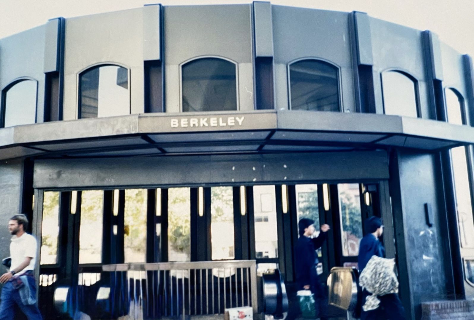 Image of a gray circular building entrance with the word 